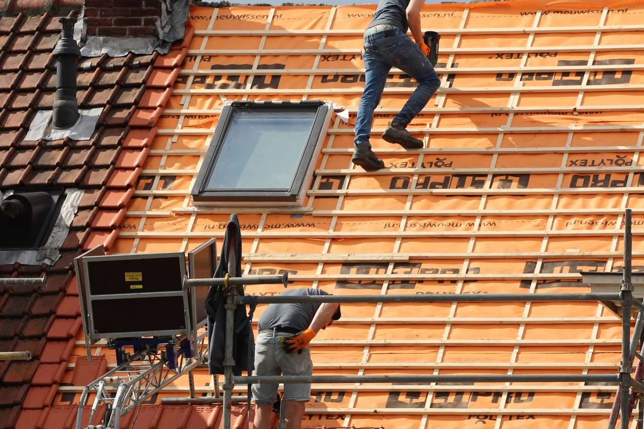 Commercial roofing crew inspecting roof of an establishment